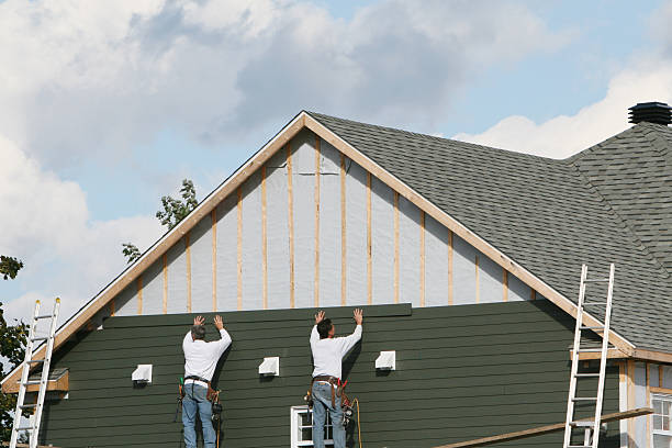 Professional Siding technician working in Olivia, NC